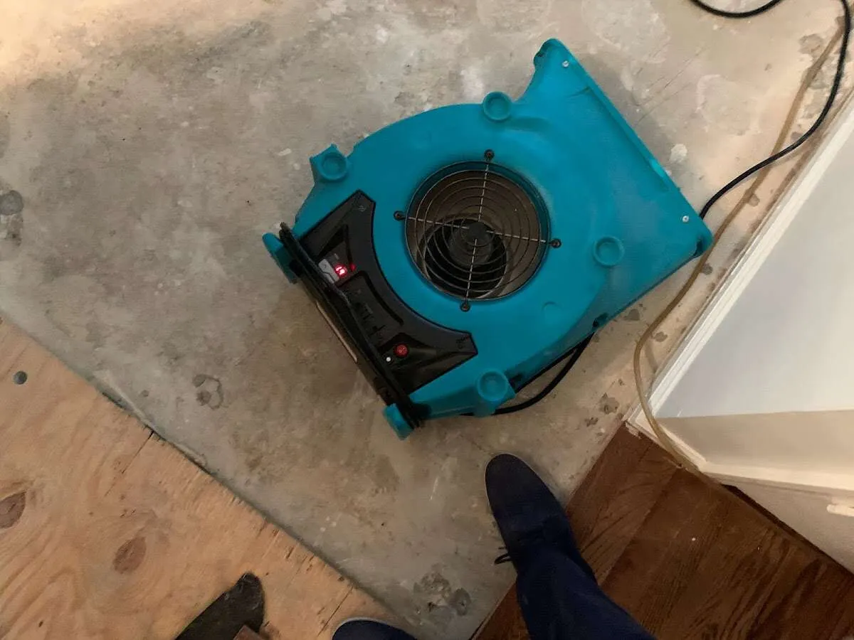 Air mover drying subfloor during Leak Detection & Repair in Angier